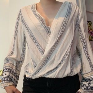 beige patterned long sleeve blouse